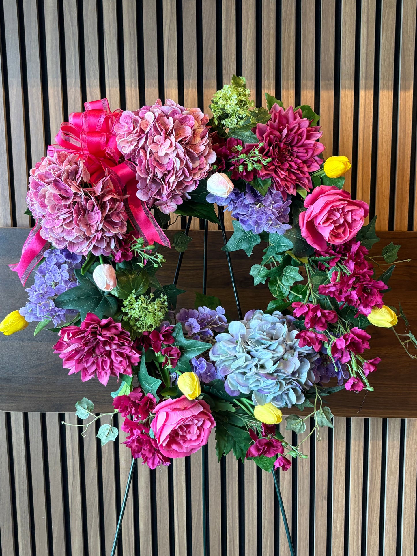 Wreath Hydrangeas delphinium, and roses